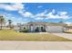 Charming single-story home featuring a well-maintained lawn, two-car garage and a welcoming entrance at 1391 Willow Crest Dr, Clermont, FL 34711
