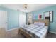 Bedroom suite featuring a bed, and decorated in light blue, with an adjacent closet at 1524 Flange Dr, Davenport, FL 33896