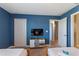 Cozy bedroom with twin beds, closet and tv, designed for comfort and convenience at 1524 Flange Dr, Davenport, FL 33896