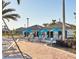 Community cabana with seating and tables, providing a shaded area for relaxation and social gatherings at 1524 Flange Dr, Davenport, FL 33896