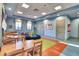 Bright community classroom or playroom with tables, chairs, and colorful decor for activities and learning at 1524 Flange Dr, Davenport, FL 33896