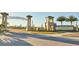 ChampionsGate community entrance featuring decorative stonework and meticulous landscaping at 1524 Flange Dr, Davenport, FL 33896