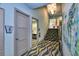 Well-maintained community clubhouse hallway with elevator, stairs and visible signage at 1524 Flange Dr, Davenport, FL 33896