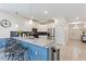 Kitchen with a breakfast bar and stainless steel appliances open to the entryway at 1524 Flange Dr, Davenport, FL 33896