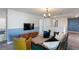 Upstairs living room with TV and cozy seating, perfect for relaxing at 1524 Flange Dr, Davenport, FL 33896