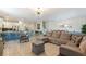 Spacious living area with an open floor plan, seamlessly connecting the living room, kitchen, and dining spaces at 1524 Flange Dr, Davenport, FL 33896