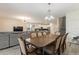 Spacious area connecting the living and dining spaces with staircase, ideal for Gathering gatherings at 1524 Flange Dr, Davenport, FL 33896