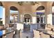 Community outdoor kitchen with bar and seating, perfect for hosting gatherings and enjoying the outdoors at 1524 Flange Dr, Davenport, FL 33896