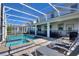 The screened-in pool and spa is great for entertaining; outdoor furniture makes this space complete at 1524 Flange Dr, Davenport, FL 33896