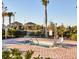 Community spa with access lift and safety railing, set amongst mature trees and lush landscaping at 1524 Flange Dr, Davenport, FL 33896