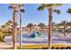 Community splash pad with water features and palm trees, offering a fun space for outdoor activities at 1524 Flange Dr, Davenport, FL 33896