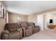 Comfortable theater room with reclining seating and neutral tones, offering a cozy entertainment space at 1524 Flange Dr, Davenport, FL 33896