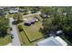 An aerial view of a home showing the ample yard space and perimeter fencing at 16 General Doolittle Rd, Daytona Beach, FL 32124