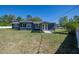 A lovely home with a large green lawn and trees, perfect for outdoor enjoyment at 16 General Doolittle Rd, Daytona Beach, FL 32124