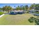 An aerial view showcasing the expansive, fenced backyard of a well-maintained home at 16 General Doolittle Rd, Daytona Beach, FL 32124
