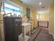 Laundry room with utility sink, water heater, and washer/dryer hookups at 16 General Doolittle Rd, Daytona Beach, FL 32124