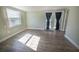 Bright living room with natural light and French doors to backyard at 16 General Doolittle Rd, Daytona Beach, FL 32124