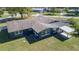 An aerial view showcasing the home's rear exterior and covered patio at 16 General Doolittle Rd, Daytona Beach, FL 32124