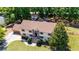 Expansive two-story home featuring a charming brick facade and lush landscaping at 16017 Harbar Oaks Dr, Montverde, FL 34756
