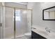 Updated bathroom with a framed glass door shower, modern vanity with sink, and chrome fixtures at 16017 Harbar Oaks Dr, Montverde, FL 34756
