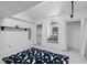 Bright bedroom with a blue rug, drop ceiling, large closets and a window seat with natural light at 16017 Harbar Oaks Dr, Montverde, FL 34756