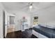 Bedroom with a daybed, vanity, hardwood floors, and natural light at 16017 Harbar Oaks Dr, Montverde, FL 34756