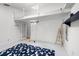 White walled bonus room features a ladder to a raised loft space, blue rug and modern decorations at 16017 Harbar Oaks Dr, Montverde, FL 34756