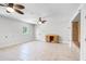 Bright bonus room with tile floors, dual ceiling fans and built in desk and cabinets at 16017 Harbar Oaks Dr, Montverde, FL 34756