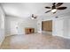 Bright bonus room with tile floors, dual ceiling fans and built in desk and bench at 16017 Harbar Oaks Dr, Montverde, FL 34756