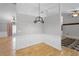 Inviting dining room with hardwood floors, crown molding, and modern lighting at 16017 Harbar Oaks Dr, Montverde, FL 34756