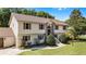Charming front exterior featuring a well-kept lawn and a classic two-story design at 16017 Harbar Oaks Dr, Montverde, FL 34756