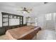 Large game room featuring tile floors, built-in shelving, and a pool table at 16017 Harbar Oaks Dr, Montverde, FL 34756