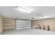 Large two-car garage with updated door, lighting, and storage space at 16017 Harbar Oaks Dr, Montverde, FL 34756
