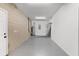 Spacious two car garage with block walls, exterior door, and water heater at 16017 Harbar Oaks Dr, Montverde, FL 34756
