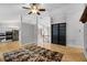 Spacious living area featuring hardwood floors, large windows, and an open layout at 16017 Harbar Oaks Dr, Montverde, FL 34756