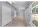 The bright bedroom offers multiple closets, wood-look floors, and a ceiling fan at 16017 Harbar Oaks Dr, Montverde, FL 34756