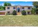 Charming two-story home boasts an inviting entrance and lush front yard at 16017 Harbar Oaks Dr, Montverde, FL 34756