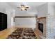 Open concept living space with hardwood floors and brick fireplace at 16017 Harbar Oaks Dr, Montverde, FL 34756