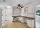 Bright office with built-in desk and cabinetry offers ample storage at 16017 Harbar Oaks Dr, Montverde, FL 34756