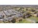 Panoramic aerial view of the neighborhood, highlighting tree coverage and community layout at 16800 Se 80Th Bathurst Ct, The Villages, FL 32162