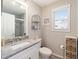 Bright bathroom with a white vanity, grey subway tile in the shower, and decorative touches at 16800 Se 80Th Bathurst Ct, The Villages, FL 32162