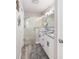 Modern bathroom with double sinks, granite countertops, sleek fixtures, and a walk-in shower at 16800 Se 80Th Bathurst Ct, The Villages, FL 32162