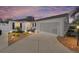 Charming single-story home featuring a well-manicured yard, a two-car garage, and a warm, inviting entrance at 16800 Se 80Th Bathurst Ct, The Villages, FL 32162