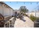 Paver patio with outdoor seating, a bar, and garden features at 16800 Se 80Th Bathurst Ct, The Villages, FL 32162