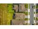 Aerial view highlighting property lines, roof, backyard with patio, in a residential neighborhood at 17291 Saw Palmetto Ave, Clermont, FL 34714
