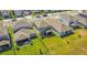 Aerial view of fenced backyards with covered patios and green lawns at 17291 Saw Palmetto Ave, Clermont, FL 34714