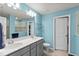 Bathroom featuring double sinks, a large mirror, and a glass-enclosed shower at 17291 Saw Palmetto Ave, Clermont, FL 34714