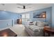 Comfortable bedroom featuring a sofa and artwork at 17291 Saw Palmetto Ave, Clermont, FL 34714