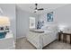 Bright bedroom with a ceiling fan, neutral colors, and a white framed bed at 17291 Saw Palmetto Ave, Clermont, FL 34714