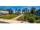 Lush community park featuring a covered gazebo, mature trees, and manicured lawn at 17291 Saw Palmetto Ave, Clermont, FL 34714